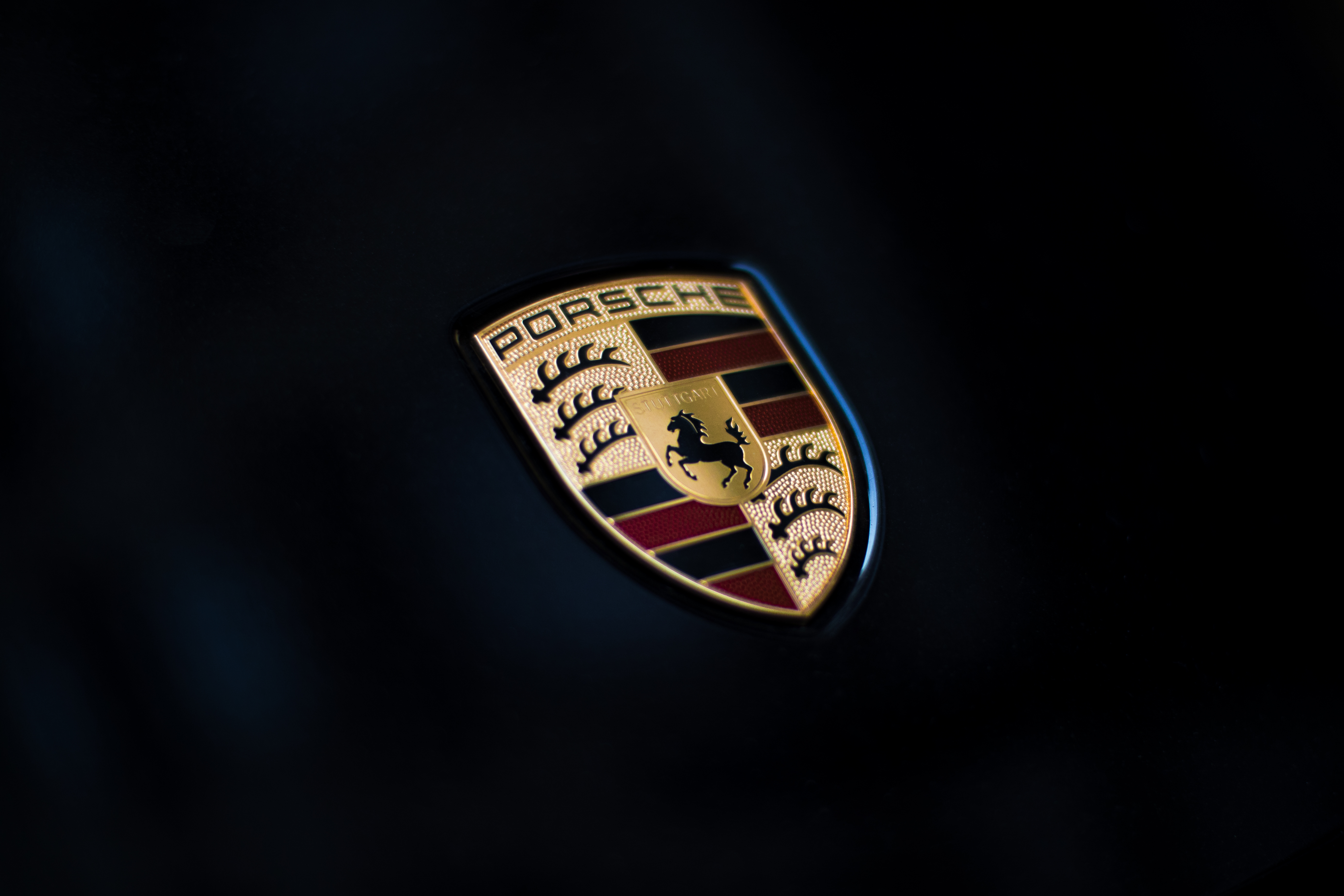 Porsche crest badge on a car